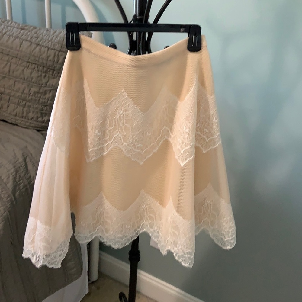 Cream Lace skirt. Below the knee